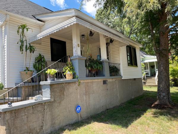 Tudi Holmes Realty